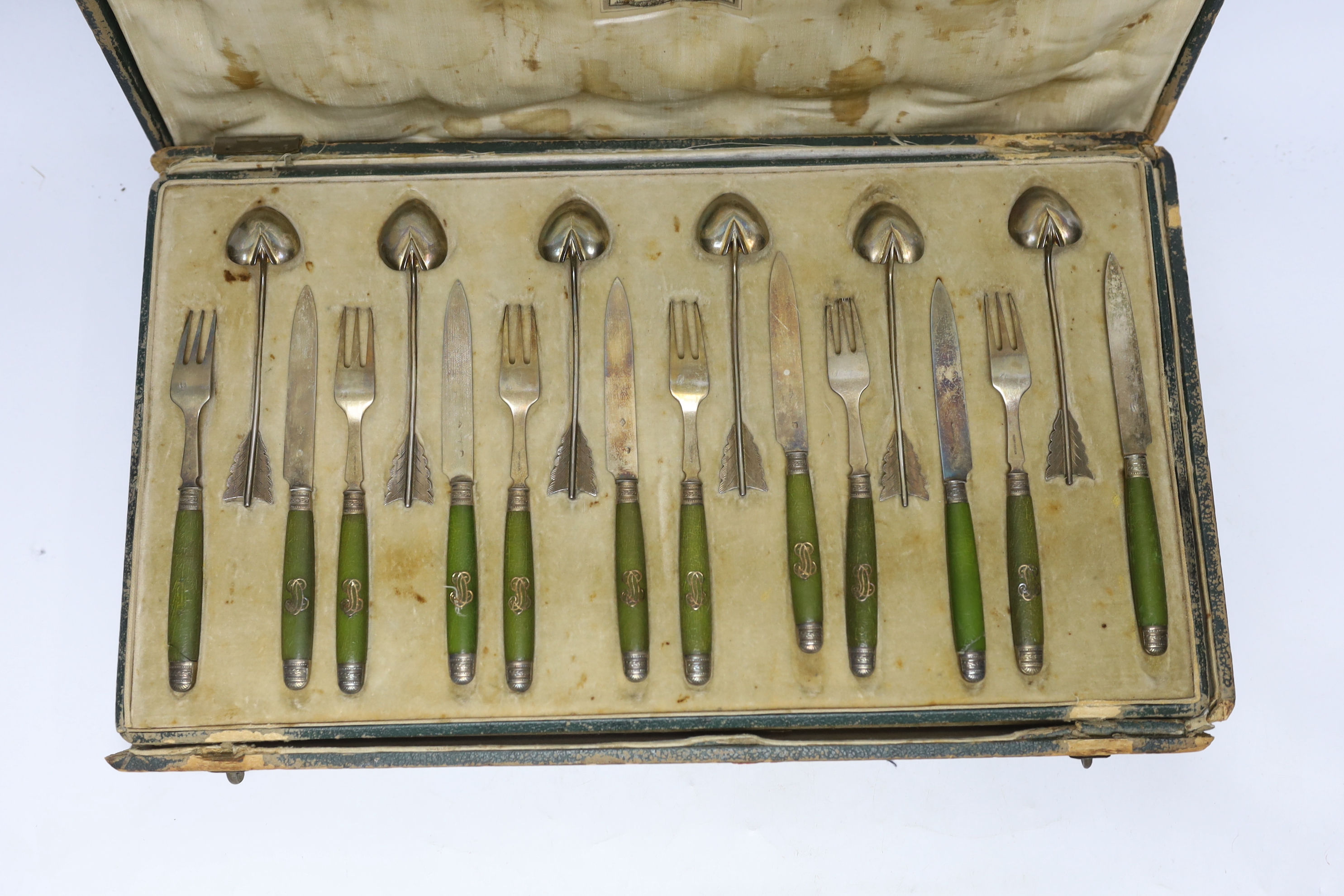 A cased French thirty six piece dessert set, comprising twelve white metal spoons and twelve pairs of phenolic handled white metal dessert eaters, all by Robert Linzeler, knife 15.5cm.